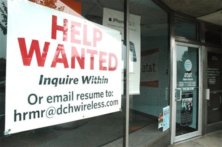 A help-wanted sign advertises an opening at an AT&T cell phone store in Rockville Centre, N.Y., last week.
